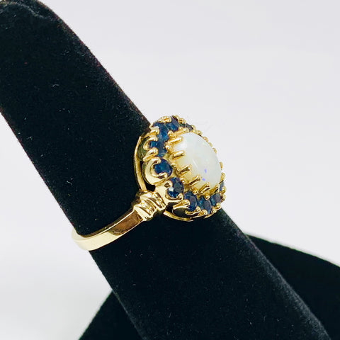 Vintage Woman's Opal and Blue Topaz Halo Ring 10k Yellow Gold - ONeil's Jewelry 